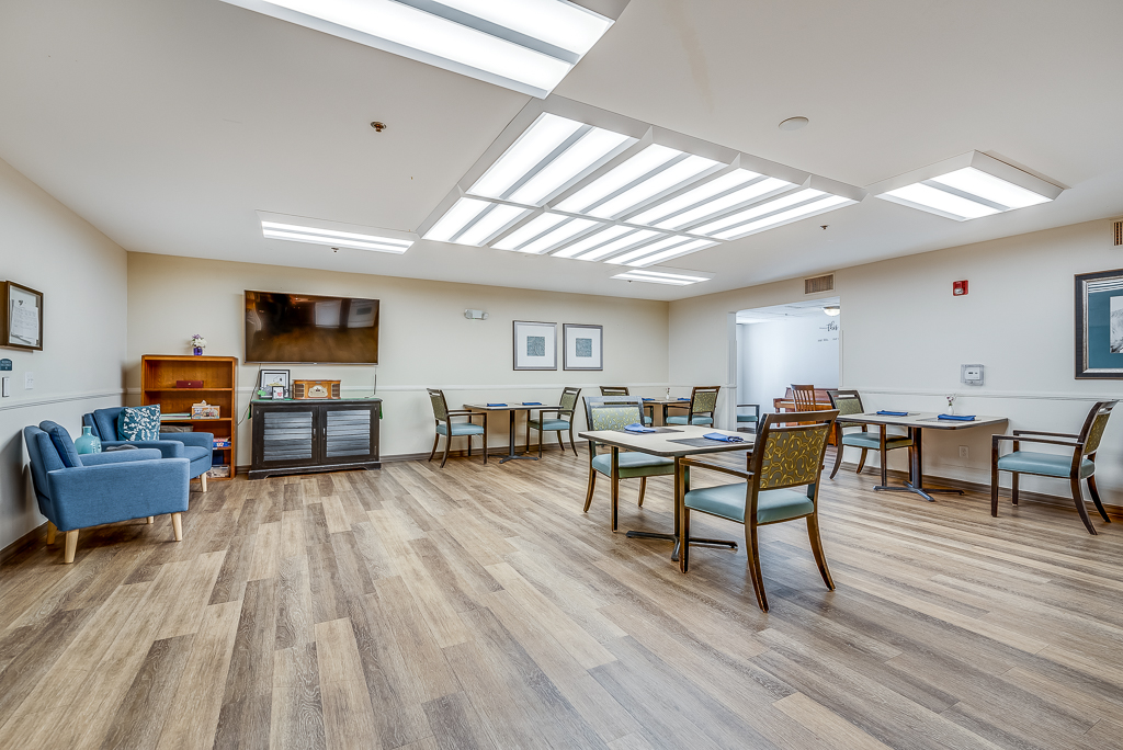 Chef putting the finishing touches on a delicious-looking plate of food